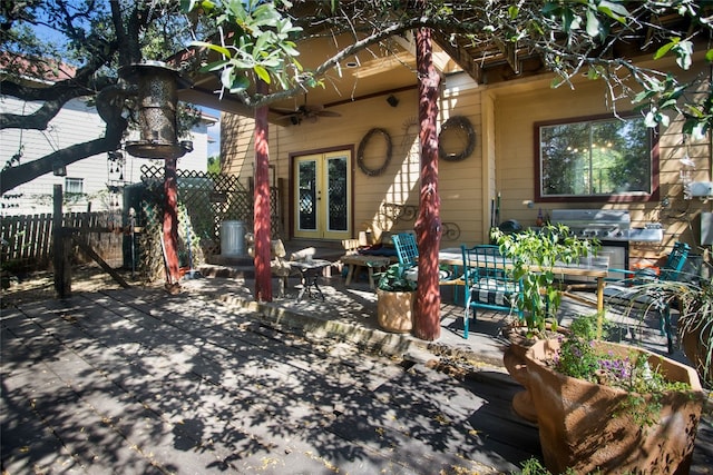 exterior space featuring a patio area, french doors, and ceiling fan