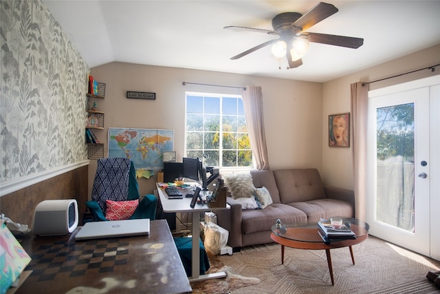 living room with lofted ceiling and ceiling fan