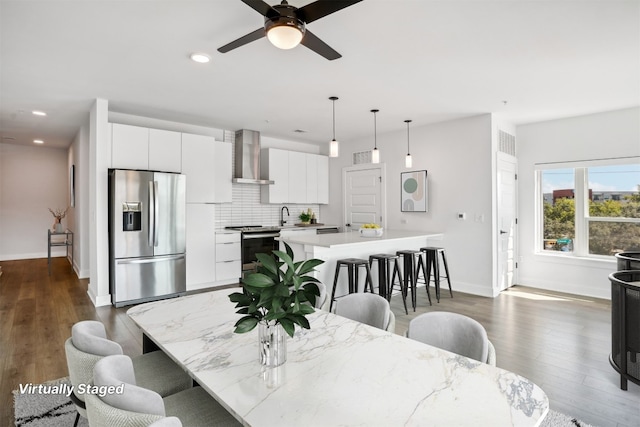 dining room featuring dark hardwood / wood-style floors and ceiling fan