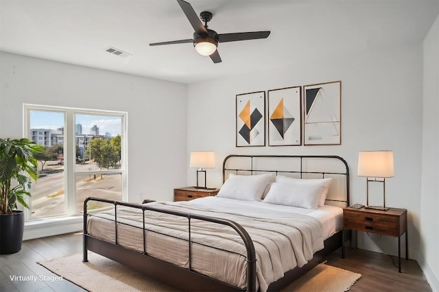 bedroom featuring hardwood / wood-style floors and ceiling fan