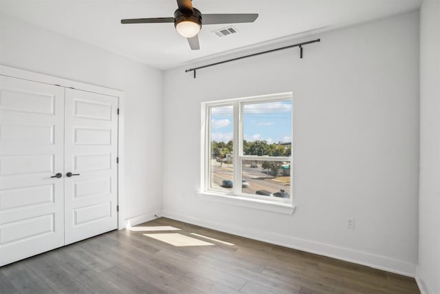 interior space featuring hardwood / wood-style flooring and ceiling fan