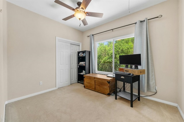 office space with light carpet and ceiling fan