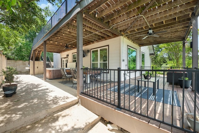 view of patio / terrace with a hot tub and ceiling fan