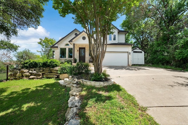 view of front of home featuring a garage and a front lawn