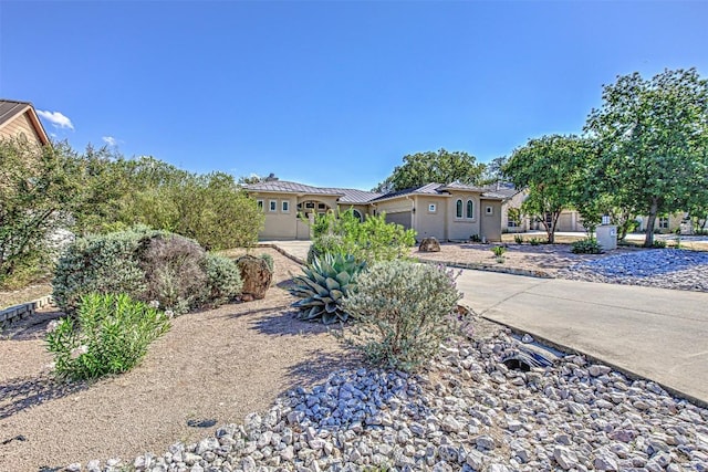 ranch-style home featuring a garage