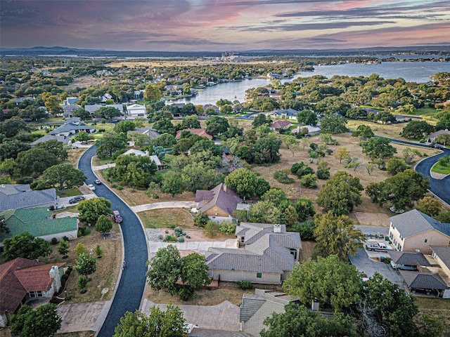 aerial view at dusk with a water view