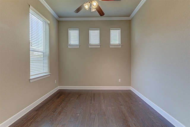 spare room featuring dark hardwood / wood-style flooring, ceiling fan, and crown molding