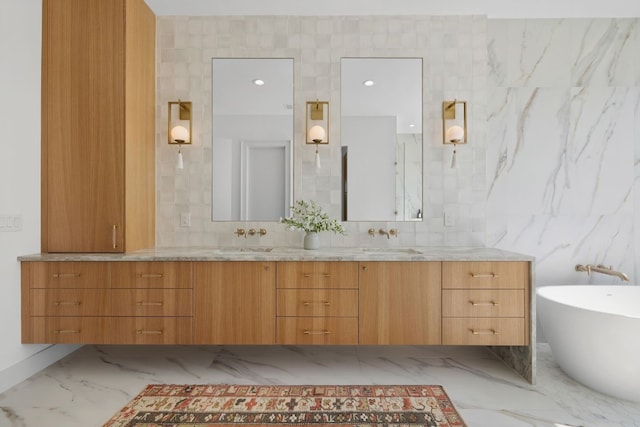 bathroom featuring vanity, tile walls, and a washtub