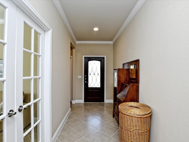 foyer with light tile patterned flooring, crown molding, and french doors