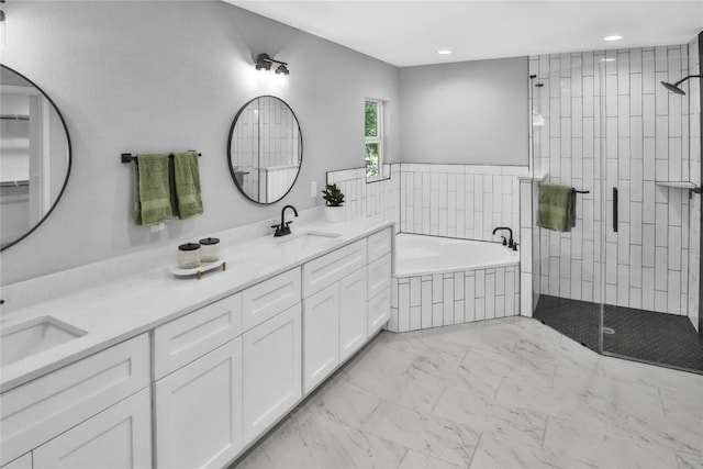 bathroom featuring vanity and separate shower and tub