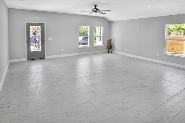 interior space featuring ceiling fan and lofted ceiling