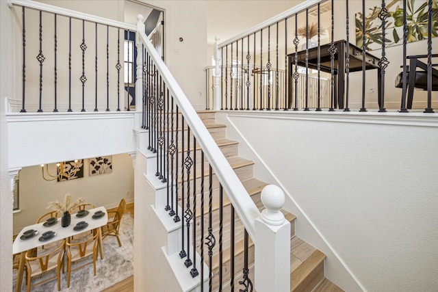 staircase featuring hardwood / wood-style flooring