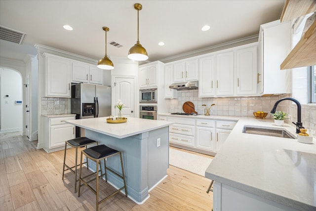 kitchen featuring white cabinetry, appliances with stainless steel finishes, and sink