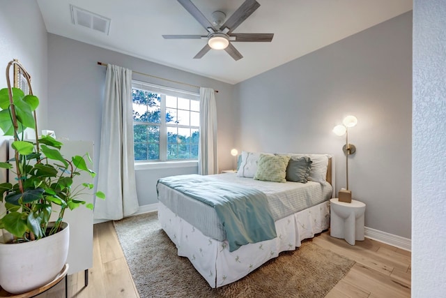 bedroom featuring light hardwood / wood-style flooring and ceiling fan