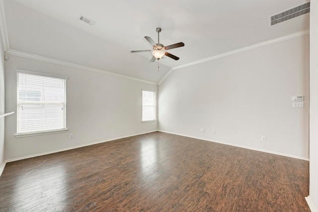 empty room with lofted ceiling, crown molding, ceiling fan, and dark wood-type flooring