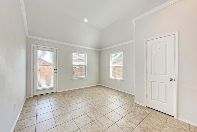 tiled spare room with ornamental molding and a wealth of natural light