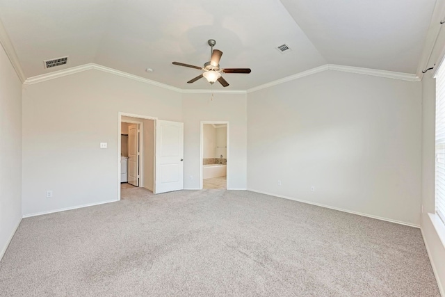 unfurnished bedroom with ornamental molding, vaulted ceiling, and ceiling fan