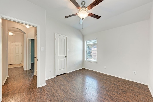 unfurnished room featuring ceiling fan, lofted ceiling, and dark hardwood / wood-style flooring