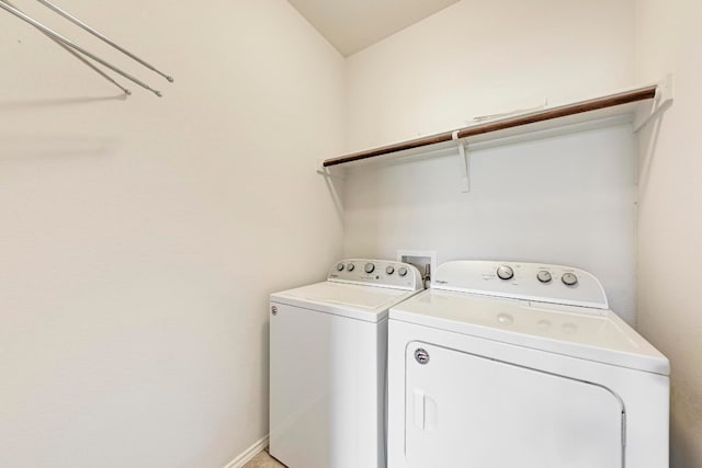 washroom with washing machine and clothes dryer