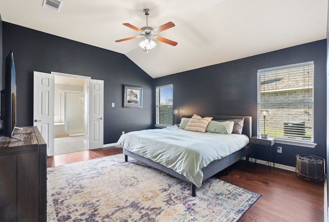 bedroom with multiple windows, ceiling fan, and dark hardwood / wood-style flooring