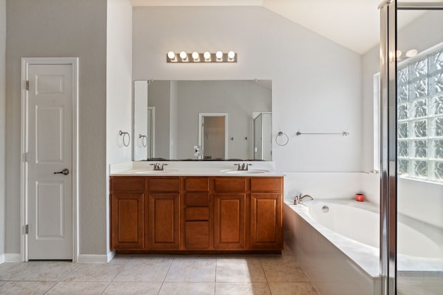 bathroom with tile patterned flooring, vanity, lofted ceiling, and plus walk in shower