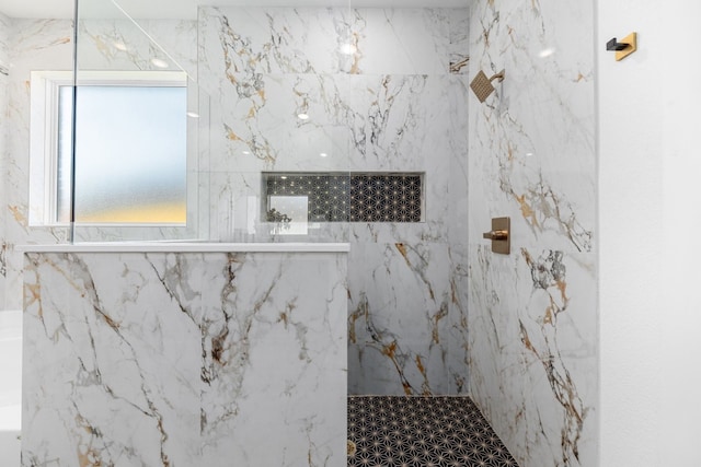 bathroom with tiled shower