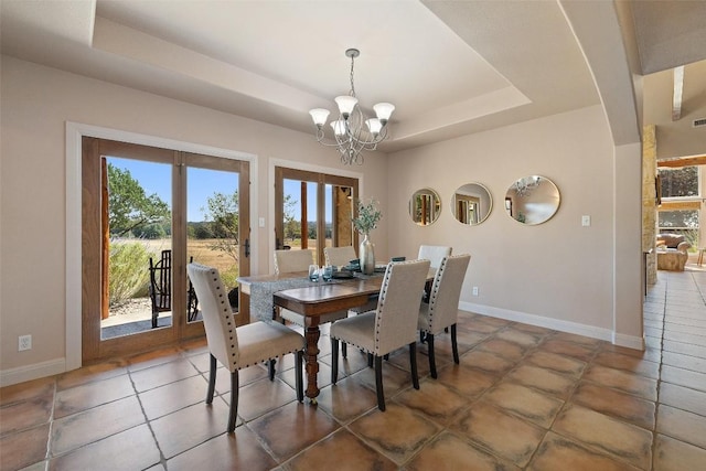 1120 Canyon View Rd, Dripping Springs, TX 78620 - dining space featuring a chandelier, plenty of natural light, a raised ceiling, and french doors