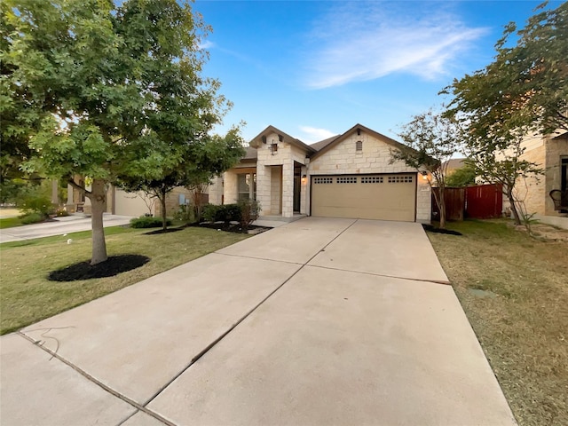 view of front of house with a front yard and a garage