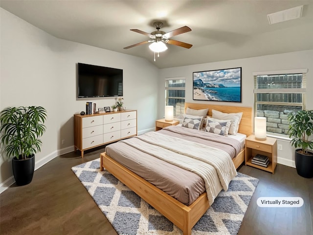 bedroom with dark wood-type flooring and ceiling fan