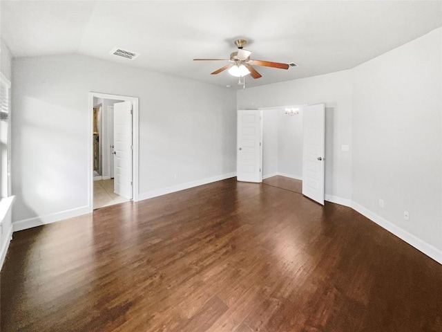 305 Rock Mill Loop, Georgetown, TX 78626 - unfurnished bedroom featuring wood finished floors, baseboards, a ceiling fan, lofted ceiling, and ensuite bath