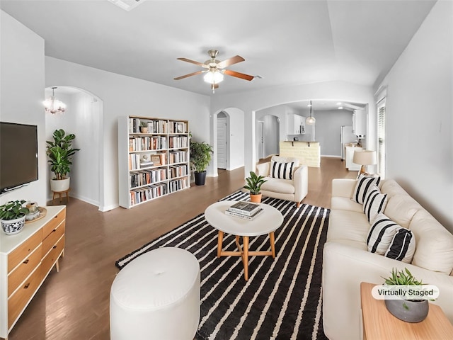 305 Rock Mill Loop, Georgetown, TX 78626 - living area with arched walkways, wood finished floors, a ceiling fan, and baseboards