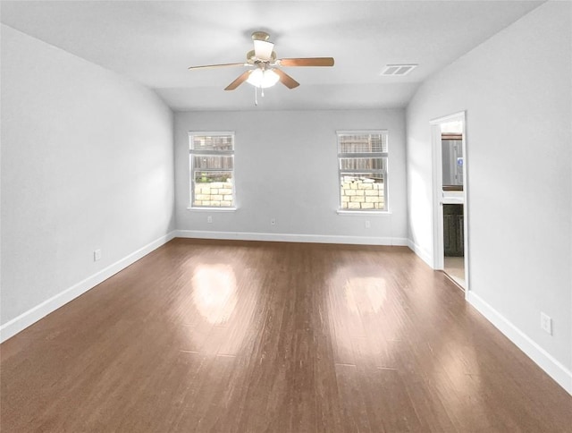 305 Rock Mill Loop, Georgetown, TX 78626 - empty room featuring plenty of natural light, a ceiling fan, wood finished floors, and baseboards