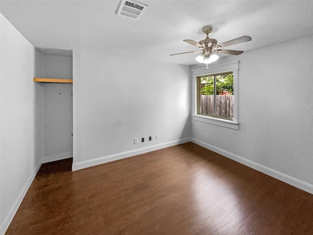 305 Rock Mill Loop, Georgetown, TX 78626 - unfurnished bedroom featuring baseboards, wood finished floors, ceiling fan, and a closet