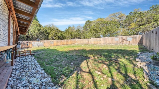 view of yard with a fenced backyard