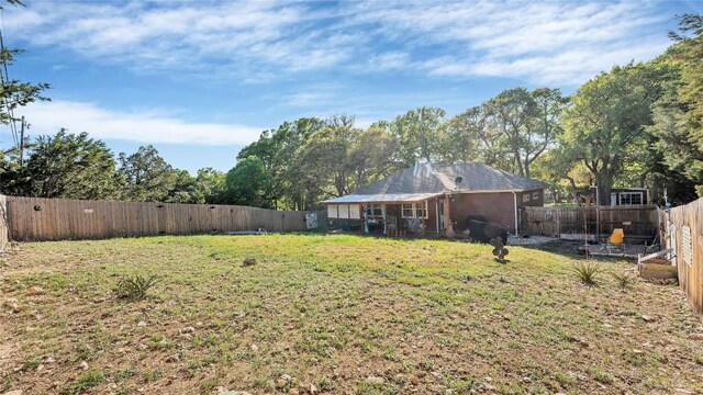 view of yard with a fenced backyard