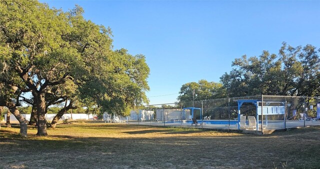 exterior space with a lawn and fence