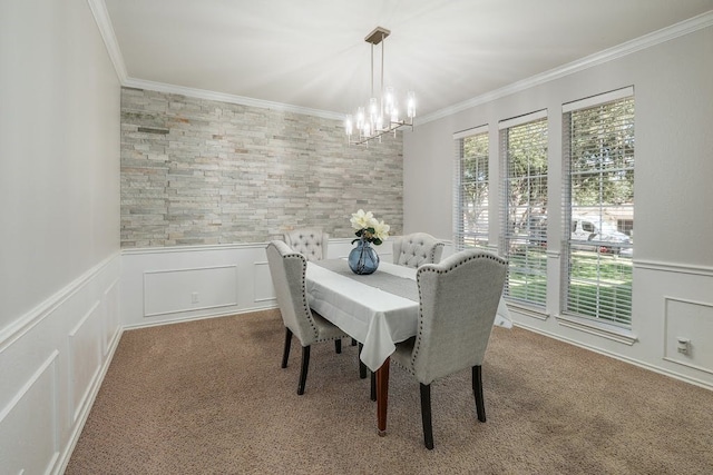 carpeted dining space with a notable chandelier, crown molding, and a wealth of natural light