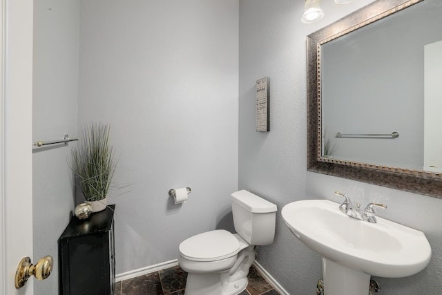 bathroom featuring toilet and sink