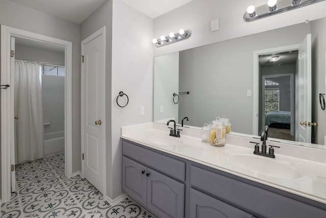 bathroom with tile patterned flooring, plenty of natural light, and vanity