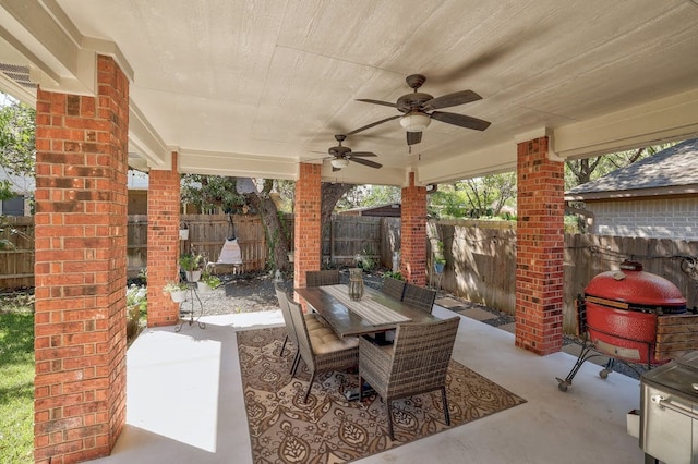 view of patio / terrace with ceiling fan and a grill