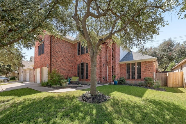 view of front of home featuring a front yard and a garage