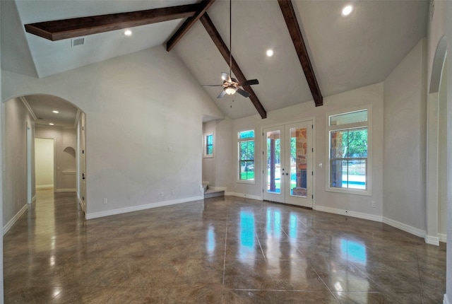 unfurnished living room featuring ceiling fan, beamed ceiling, dark tile patterned flooring, french doors, and high vaulted ceiling