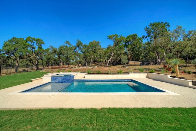 view of swimming pool featuring an in ground hot tub, a patio area, and a lawn