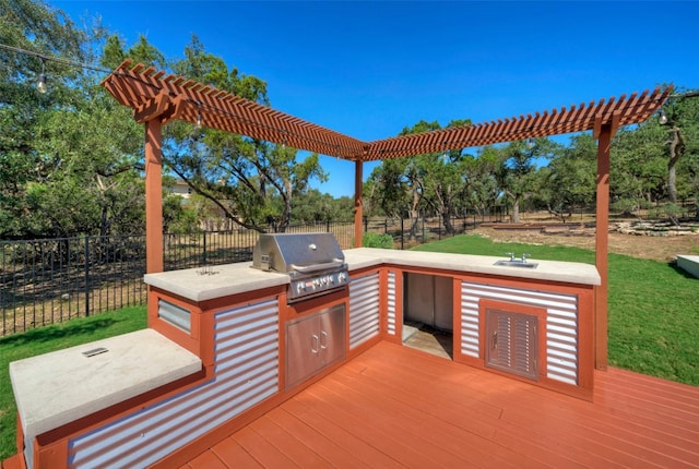 wooden deck with area for grilling, a grill, and a lawn