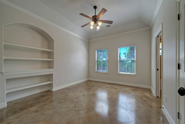 tiled empty room featuring ornamental molding, ceiling fan, vaulted ceiling, and built in features