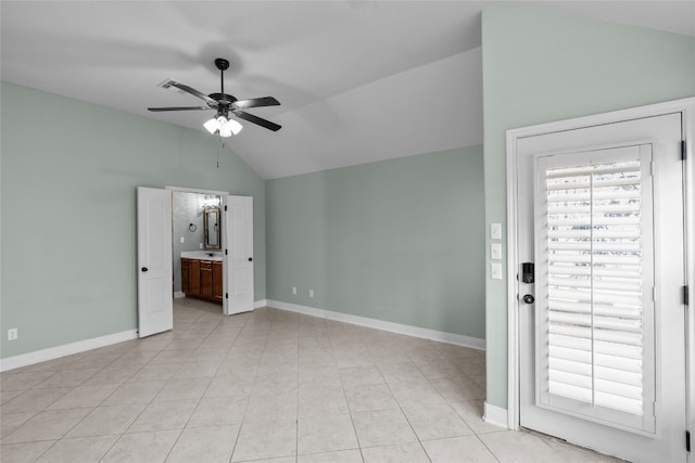 interior space with vaulted ceiling and ceiling fan