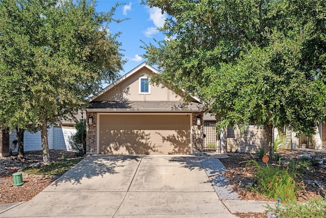 obstructed view of property with a garage