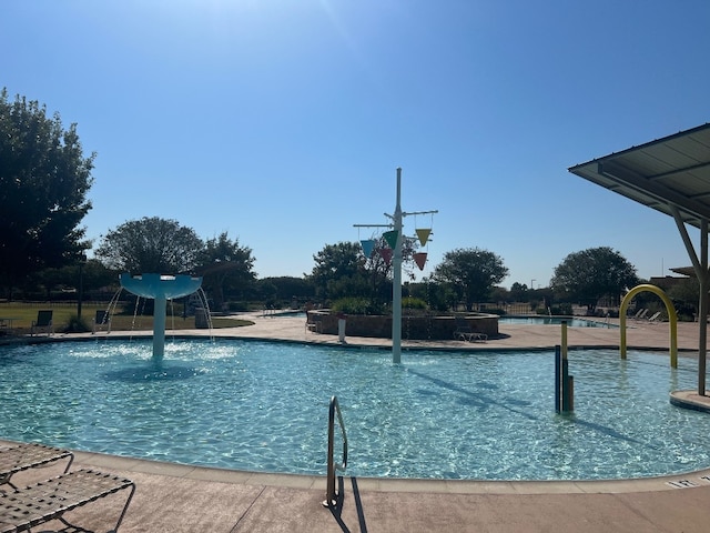 view of pool with pool water feature