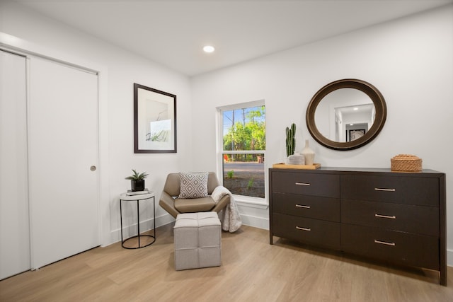 sitting room featuring light hardwood / wood-style floors