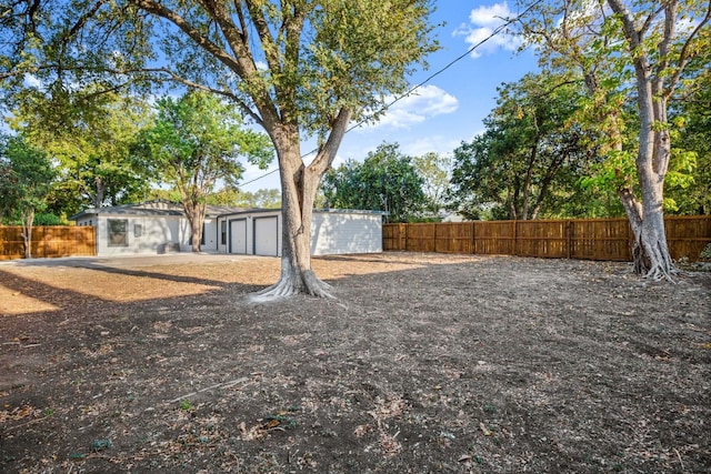 view of yard with a garage